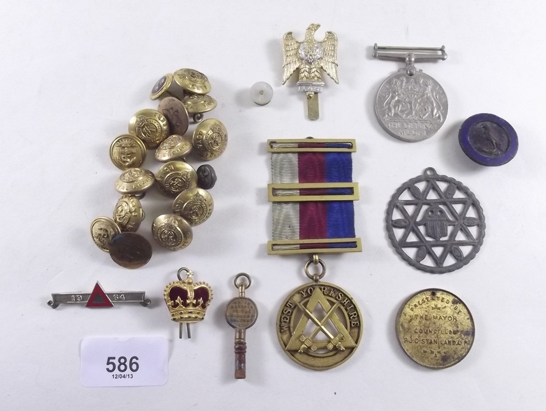 A group of various medals, buttons etc