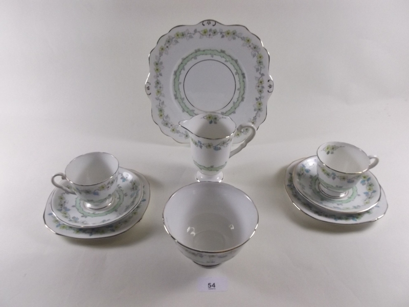 A Royal Stafford teaset No 8029 - six cups and saucers, six tea plates, milk and sugar - one