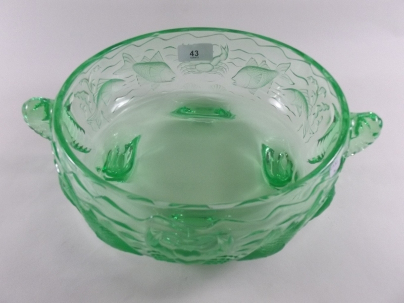 A green moulded glass fruit bowl decorated fish