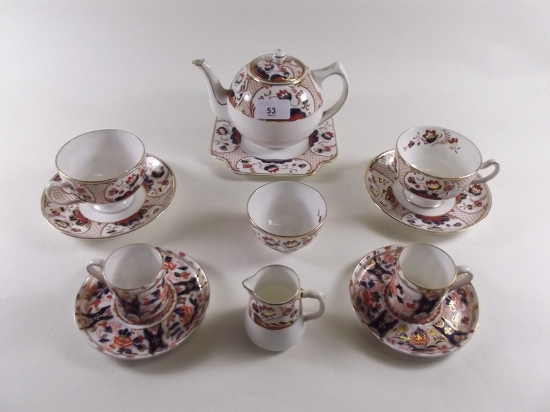 A Grafton bachelor teaset comprising teapot, sugar, cream jug, two coffee cans and saucers, two