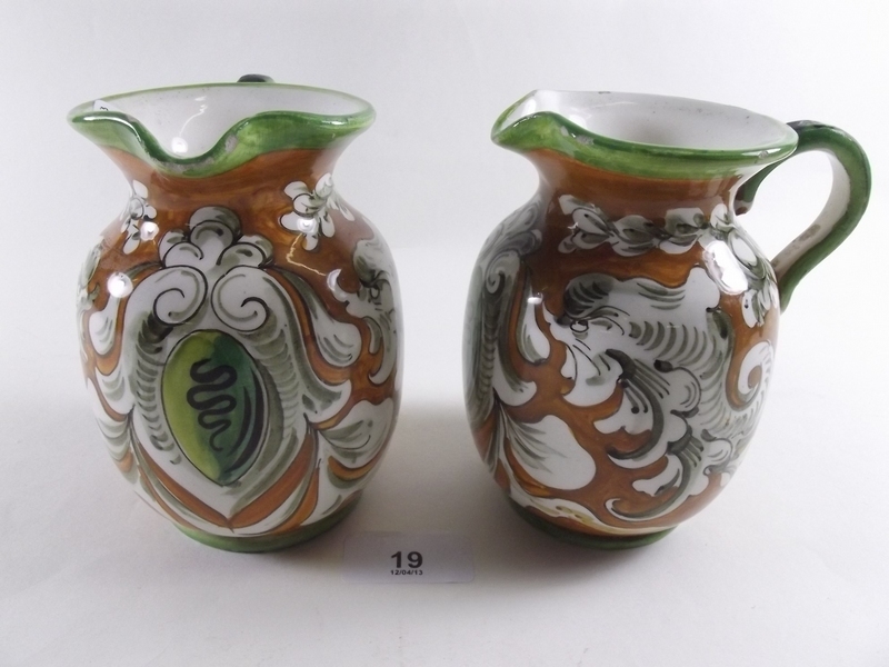 A pair of Majolica style jugs - monogram to base