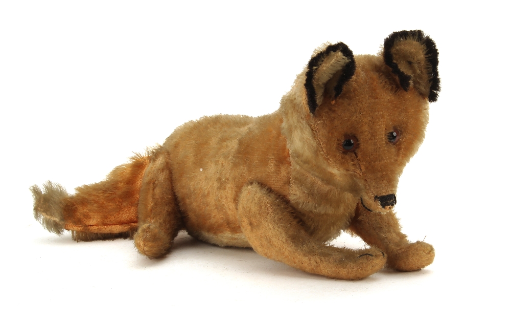 A Steiff jointed mohair Fox, circa 1910, 5317, with ginger and white mohair, clear and black glass