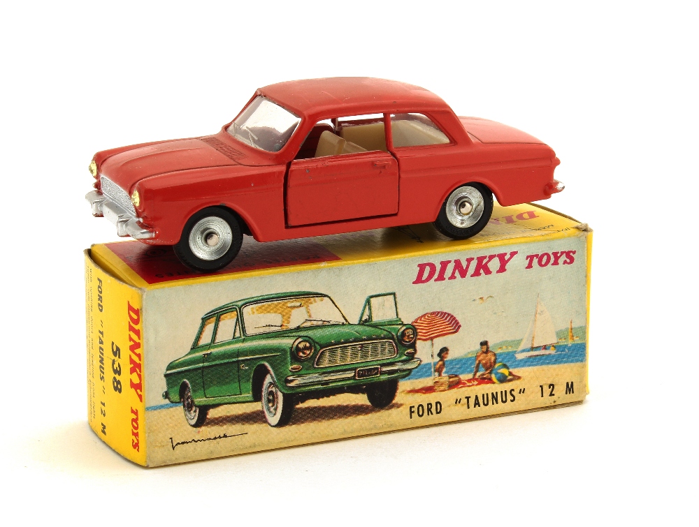 A French Dinky 538 Ford Taunus 12M, brick red body, spun hubs, in original box, E, box G, sticker