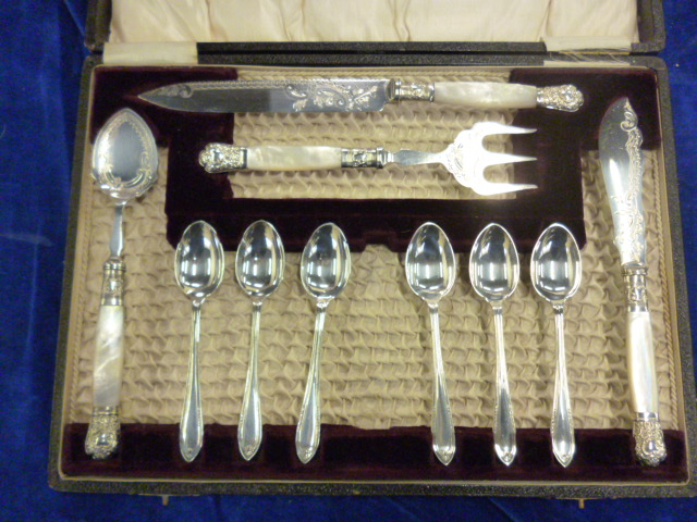 A silver plated and mother of pearl tea set in fitted case (1)