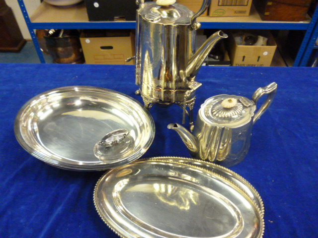 A 19th century white metal coffee pot with heater and stand together with a teapot and two entree