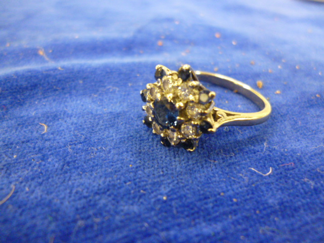 An 18 carat white gold, sapphire and diamond dress ring, 4.3g.