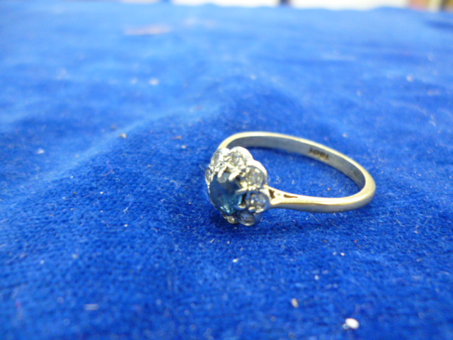 An 18ct gold, diamond and sapphire cluster ring, 2.7g