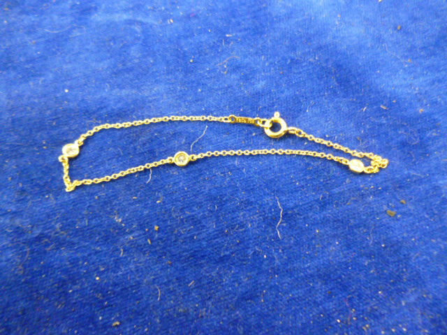 An 18ct gold and diamond Tiffany & Co child`s bracelet (1)