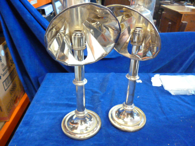 A pair of silver plated student lamps stamped Millers London