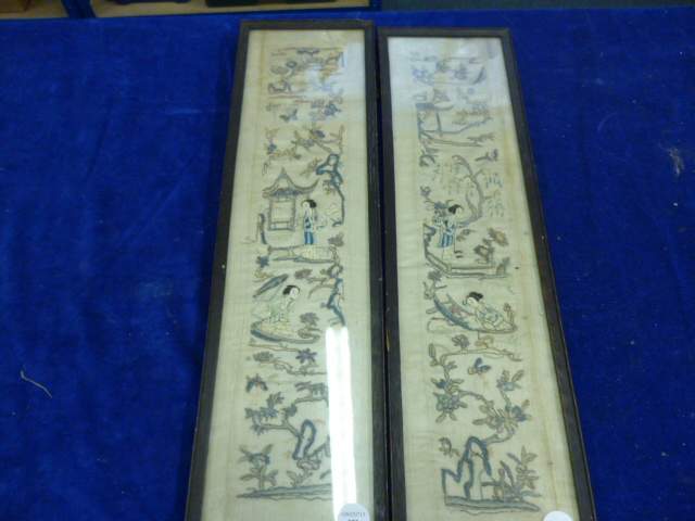 A pair of framed oriental panels hand stitched decoration depicting courtesans in stylised landscape