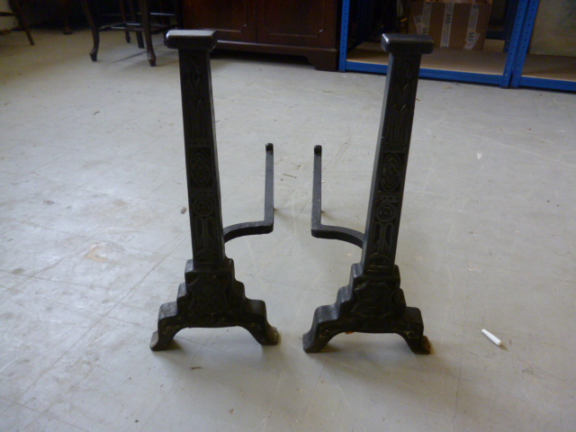 Two cast iron fire dogs