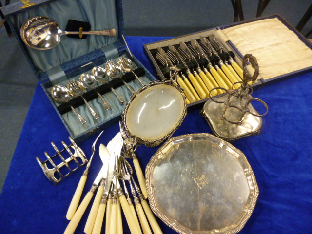 Collection of silver plated items including toast rack, soap dish, flatware and other items (