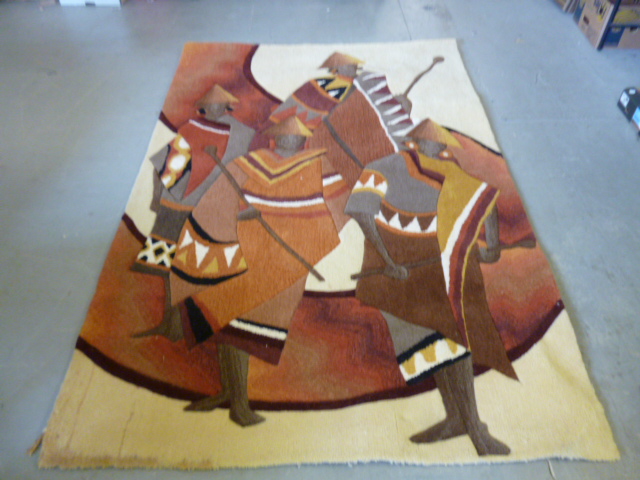 A large rug depicting four native men dressed in brown, orange and yellow, possibly hunting or