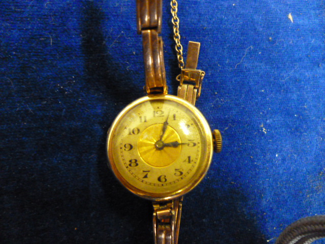A 15ct gold ladies wrist watch on 9ct gold band