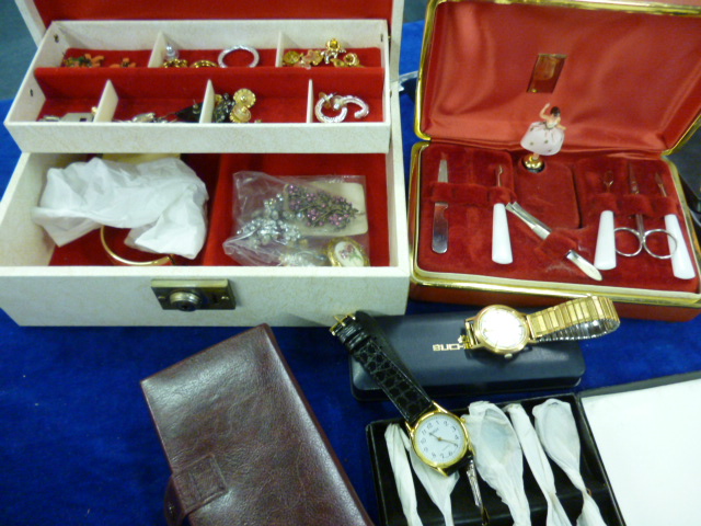 A collection of costume jewellery including a rolled gold bangle, two watches and more (qty)