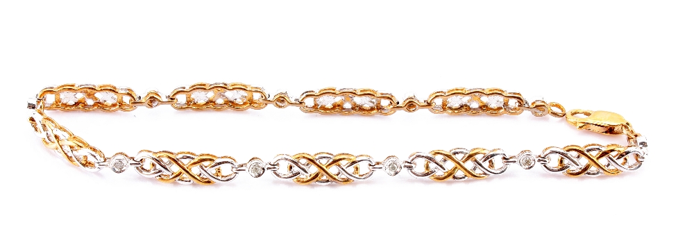 A modern 9ct gold and diamond bracelet of Celtic design in white and gold metal, in retailers box (