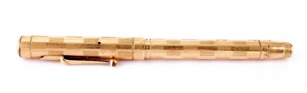 A Swan rolled gold fountain pen, with engine turned design to barrel and lid