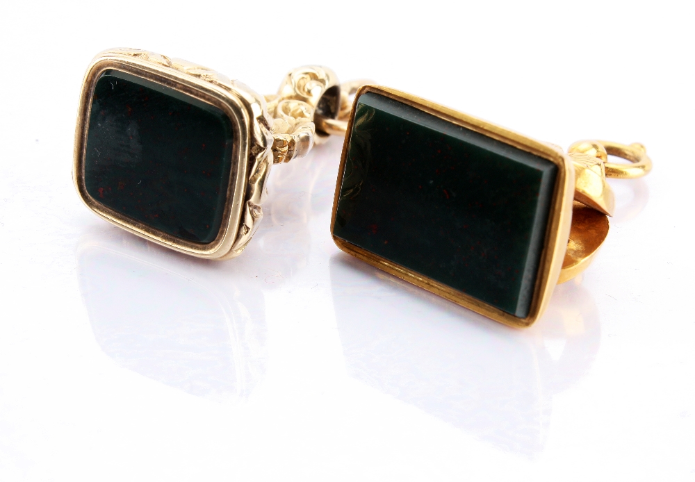 A 9ct gold mounted fob seal pendant, inset with a plain rectangular polished green hard stone top,