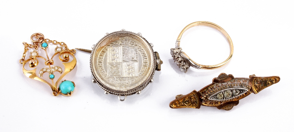 A three stone diamond crossover ring, together with a Victorian shilling mounted brooch, af, a 9ct