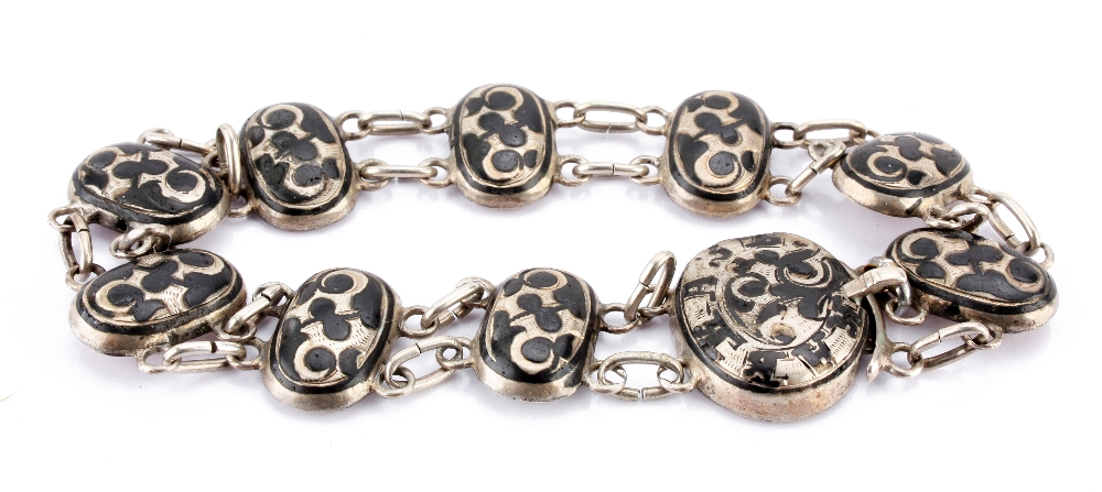 A Russian silver "niello work" bracelet, each oval link with abstract design, hallmarked