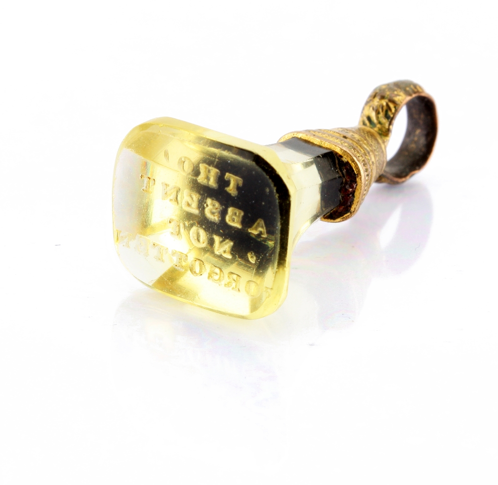A gilt metal mounted fob seal pendant, set with a faceted and flared cut citrine, the top inscribed,