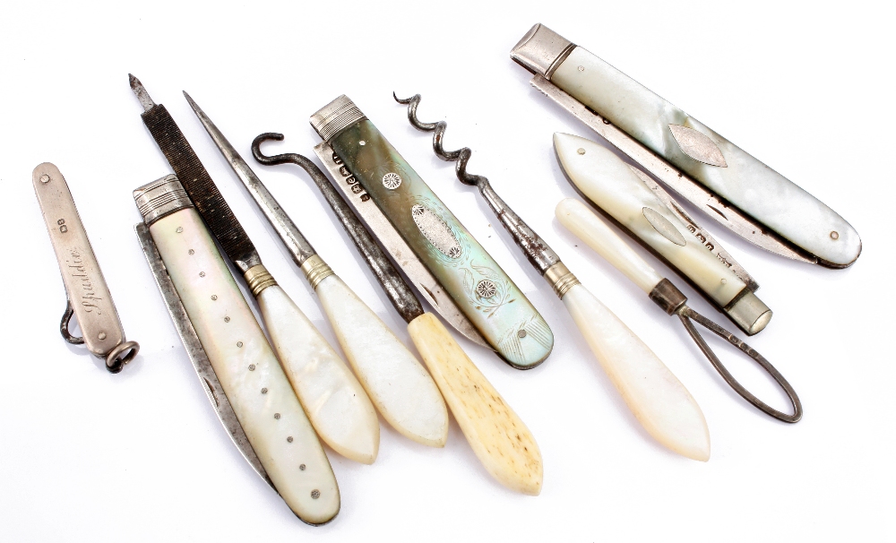 Three Georgian silver and mother-of-pearl pocket knives, together with another silver and mop pocket