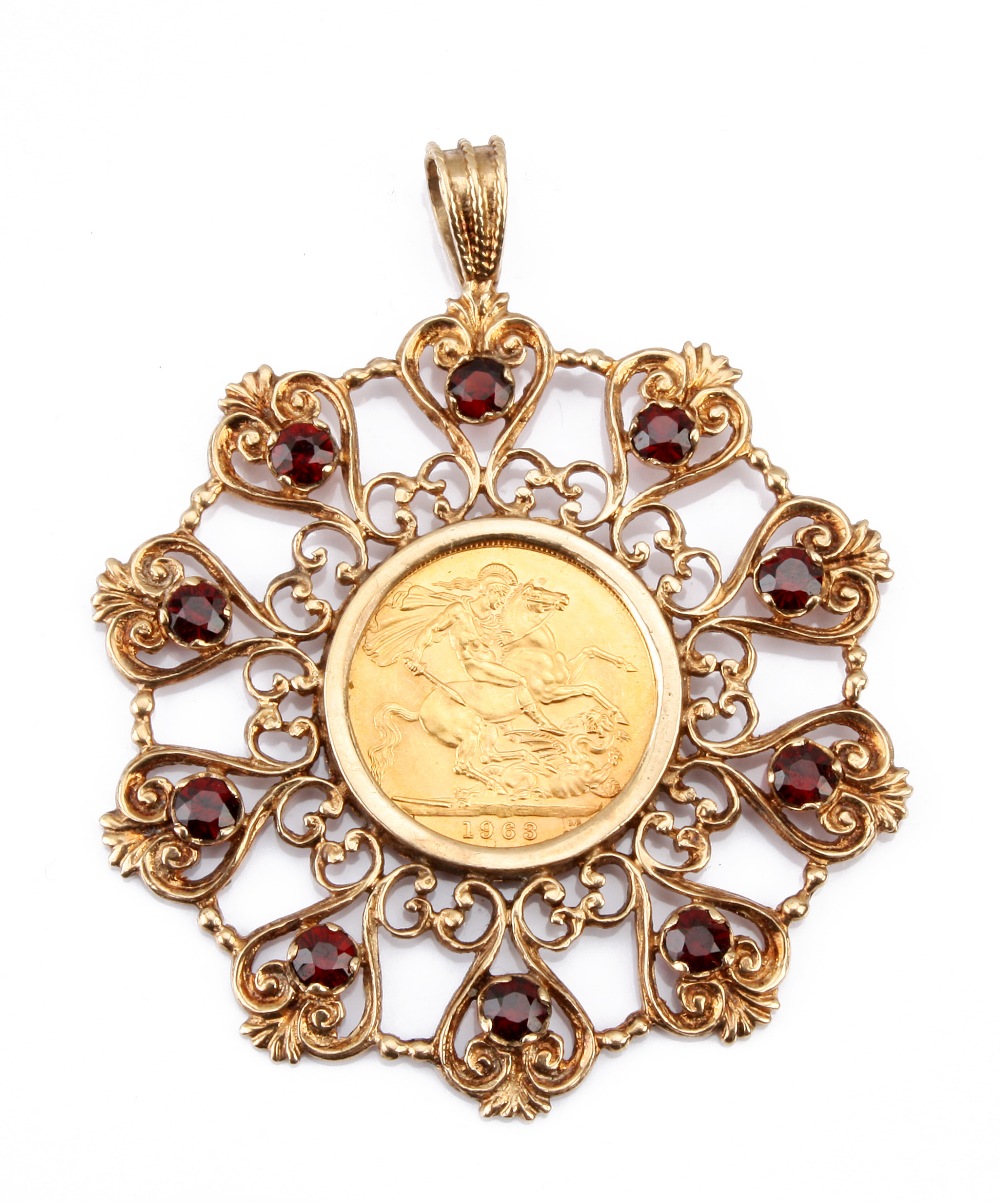 A modern full sovereign pendant, the 1963 dated coin in 9ct gold pierced and filigree circular