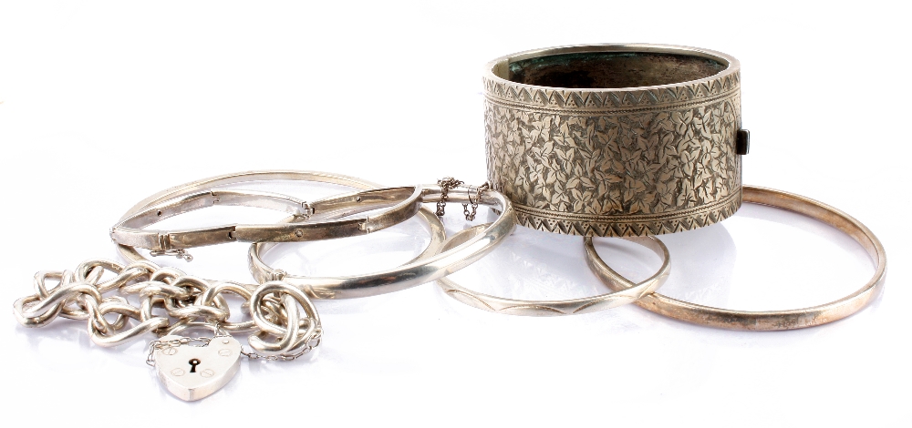 A collection of silver and white metal jewellery, including bangles, bracelets, necklaces and