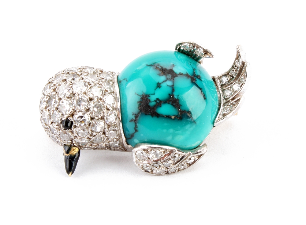 A turquoise and diamond set bird brooch, the 15ct gold mount modelled as a small bird with