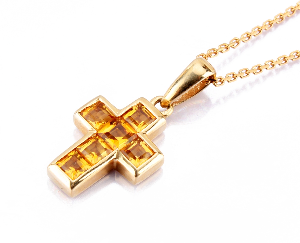 A 14ct gold and citrine set cross pendant, supported on a fine 9ct gold chain