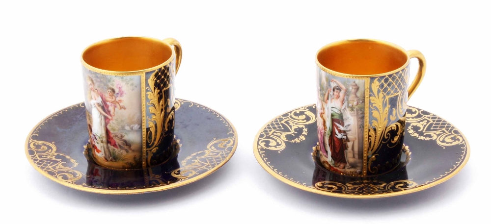 A pair of Vienna porcelain cabinet coffee cups and saucers, both with blue ground and design