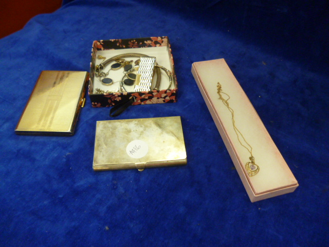 A continental silver card case, a 9ct gold necklace, and other items including bangles cufflinks etc