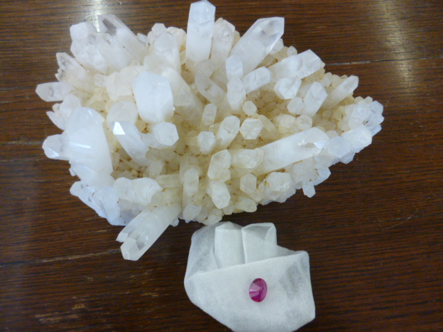 A quartz crystal formation, together with a ruby stone NO LIVE BIDDING FOR THIS SALE