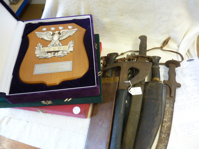 A group of military issue edged weapons, including a Kukri, Bayonet, Machete, together with three