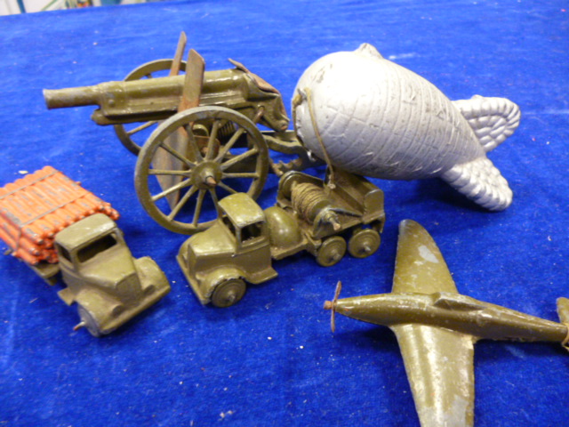 A collection of miniature Britains military vehicles including a barrage ballon, a field gun,