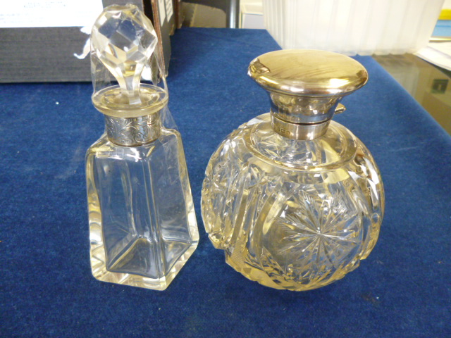 A silver and glass scent bottle together with another example (2) NO LIVE BIDDING FOR THIS SALE