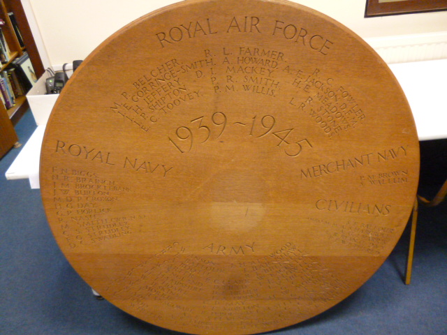 Military, a large circular, wooden, commemorative plaque recording names of servicemen lost in