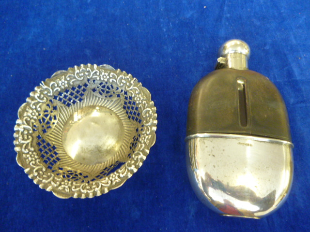 A hallmarked silver repousse decorated silver dish, together with a hip flask (2) NO LIVE BIDDING