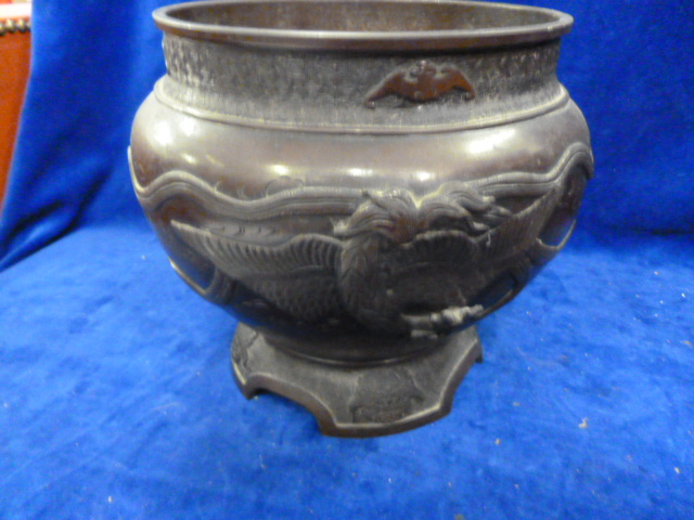 A Japanese bronze bowl, relief decorated with a cockerel and bat motifs NO LIVE BIDDING FOR THIS