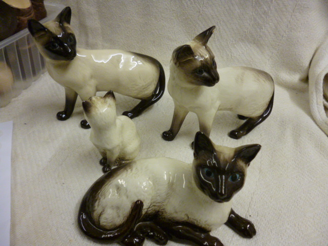 A group of four Beswick cats NO LIVE BIDDING FOR THIS SALE