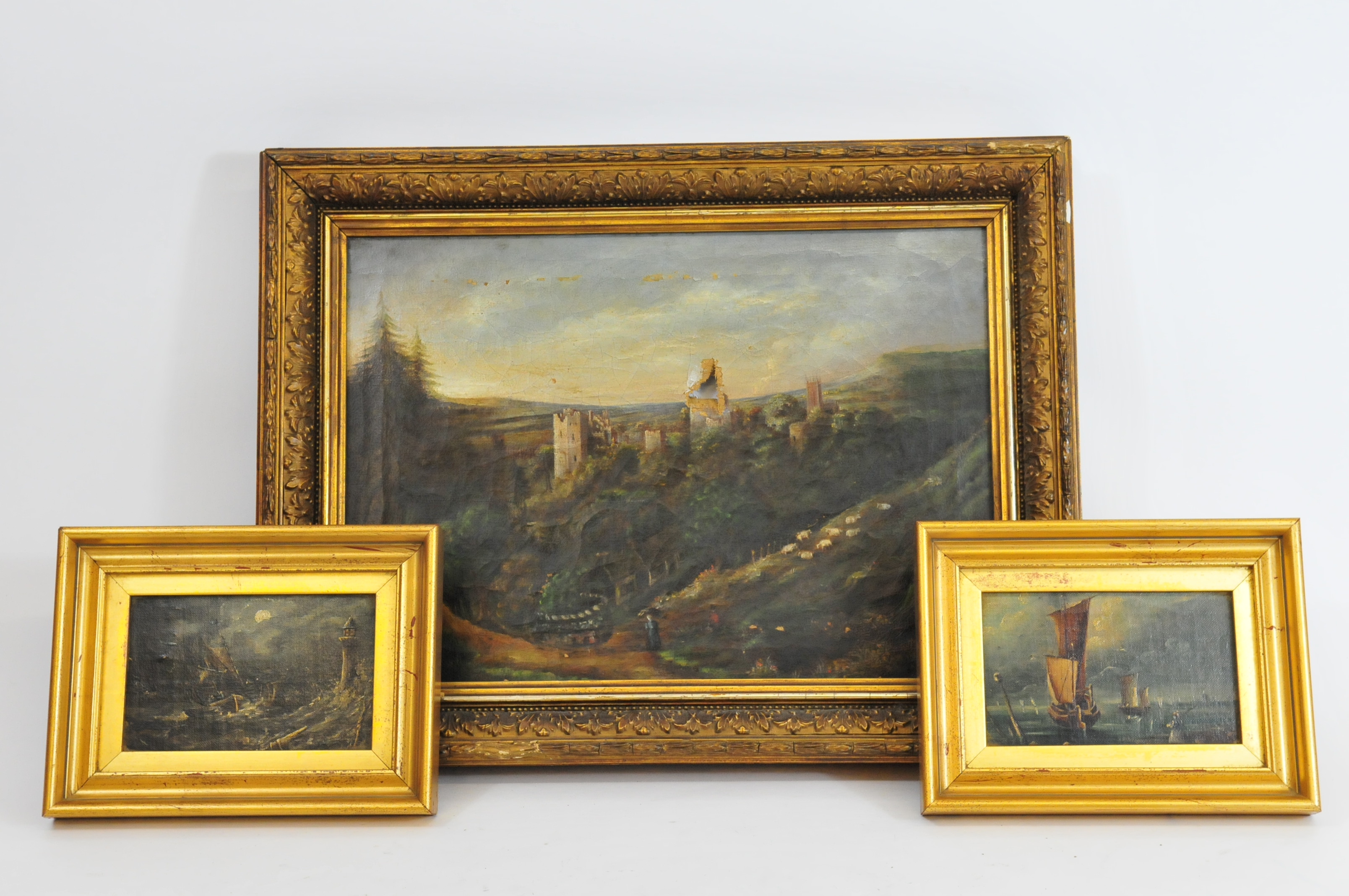 A framed oil on canvas showing castle set amongst rural scene, probably 19th century, with two small