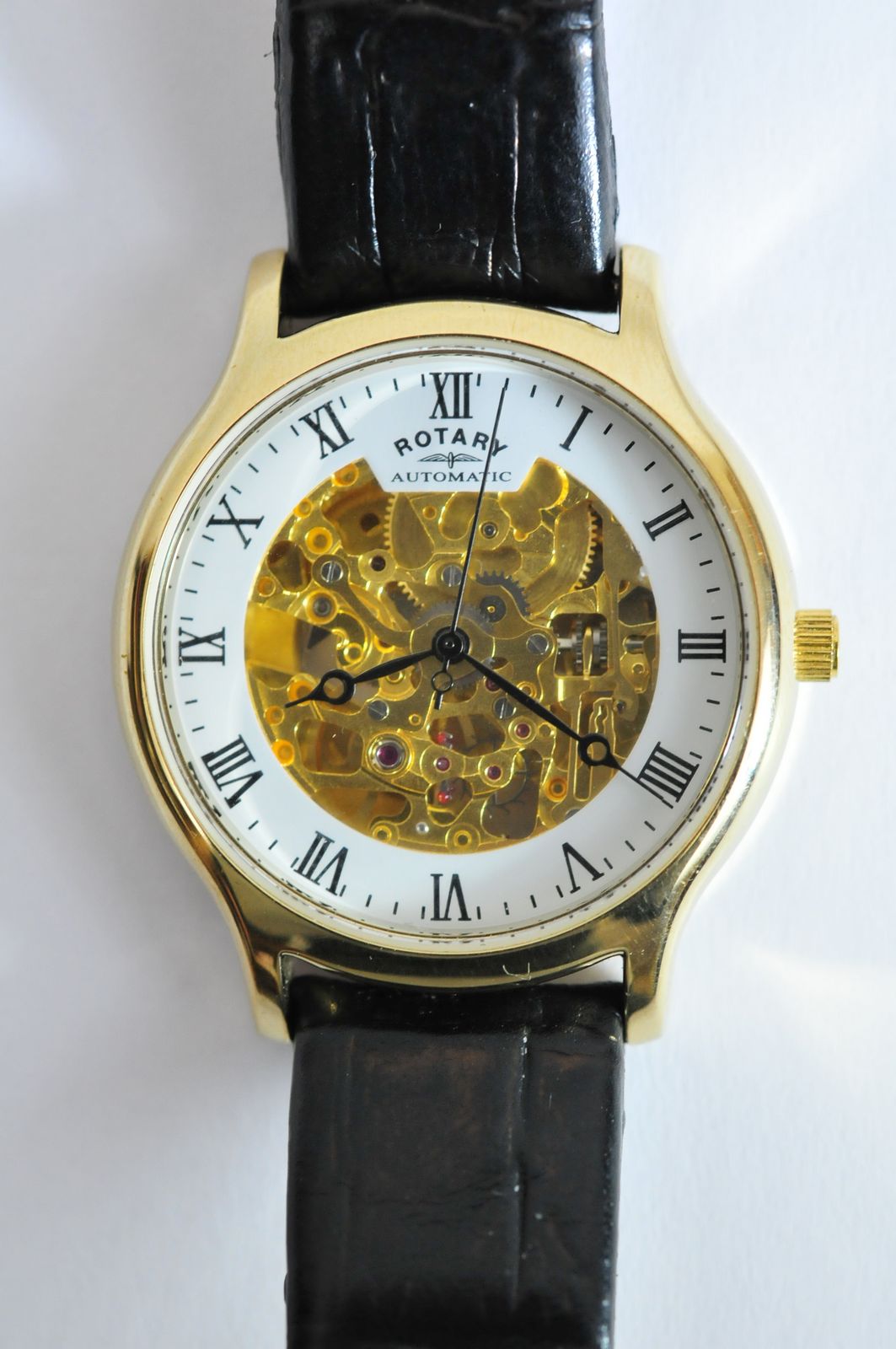 A gents Rotary Skeleton watch having visible movement from both sides and black leather strap