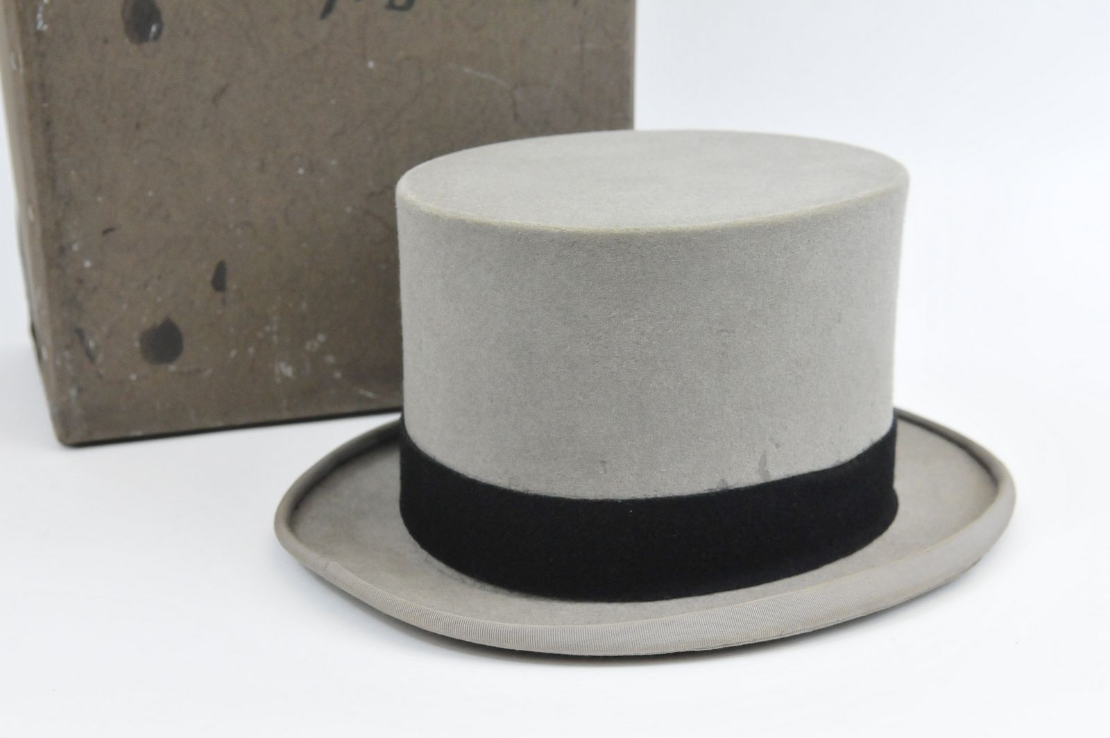 A fine quality Charles Scotney top hat of grey colour with black band size 7/1.8, in mint