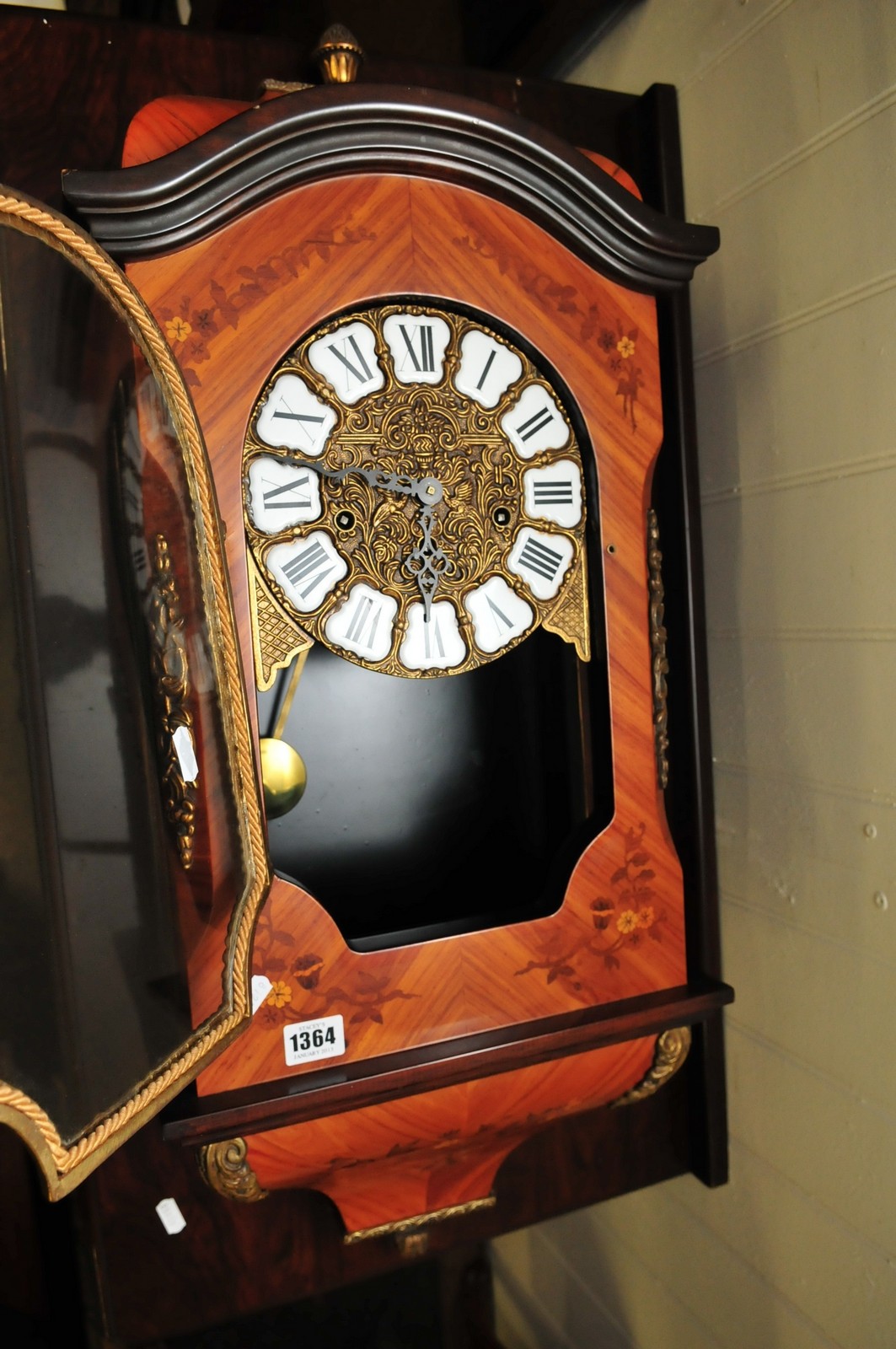 A French style marquetry wall clock with an enamel dial and guilt metal mounts