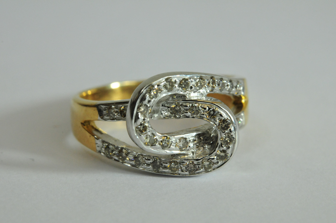 A ladies 9ct yellow gold ring formed from two interlocking crossover diamond set hoops. Size I
