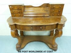 Victorian burr walnut dressing table with bow front, drawers above and shaped shelf stretcher, width