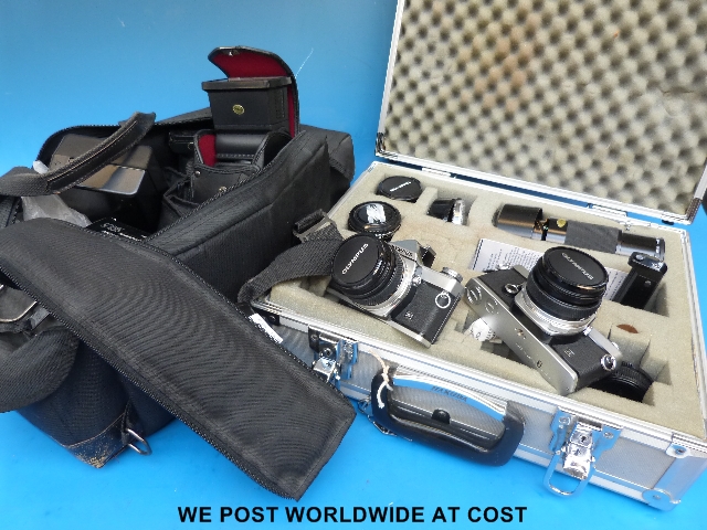 Two Olympus cameras, lenses and accessories