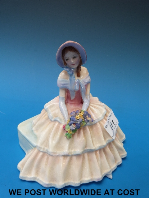 A Royal Doulton figurine "Chloe Daydreams" (HN 1701).