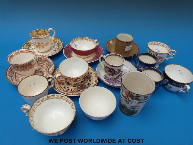 A collection of Spode cups and saucers with two Spode porcelain cups & saucers with heavily gilded