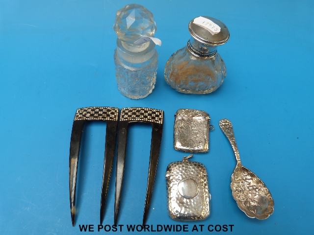 Silver vestas, berry spoon and silver-topped glass bottle etc.